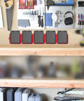 Heavy Duty Milwaukee 18V Battery Holder Storage Pack for wall mount in workshop setting with red color-coded holders