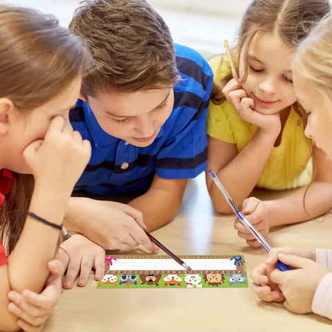 Children using Kid Friendly Desk Labels Pack, 40 Reusable Woodland Themed Name Plates With Alphabet And Numbers in classroom
