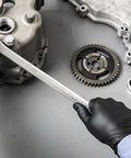 Mechanic using 17 Piece XL Gear Box Double Box End Ratcheting Wrench Set Metric For Pros Off Corner Loading on engine component