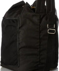 Side view of black heavy duty welding gear bag with large main compartment and mesh side pocket for gloves and water bottles