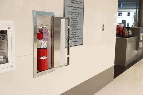10 Pound ABC Dry Chemical Fire Extinguisher With Wall Bracket For Home And Office, 4A80BC Rating, installed in a wall cabinet