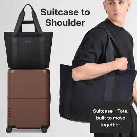 Front view of July Carry On Max expandable 21.5-inch dark brown carry-on luggage with black travel tote.
