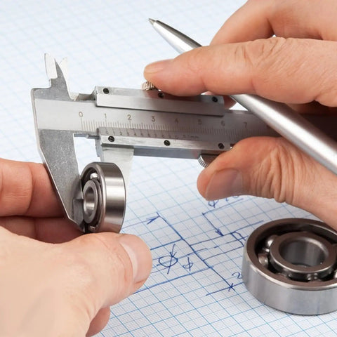 Person measuring 693ZZ Double Shielded Deep Groove Ball Bearing with caliper, showcasing precision sizing for skateboards and bikes.