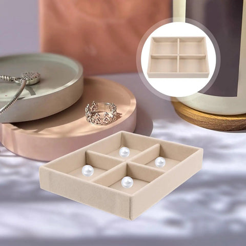 No Sweat Beige Velvet Jewelry Tray With Four Grid Compartments For Quick Sorting Rings Earrings And Bracelets Easy Drawer Insert Organizer on a table with jewelry.