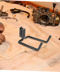 Heavy Duty Track Hooks 10 Piece Set For Truck Tie Down And Garage Organization Built Tough Adjustable Utility Hooks visible on a workbench