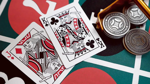 Close-up of Premium Roulette Casino Playing Cards Crafted For Magicians And Card Sharks Featuring Dope Vintage Graphics on a vibrant table.