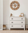 White dresser with 4 Pack Nickel Pocket Door Handles Flush Ring Pulls in a modern room with a decorative wall clock.