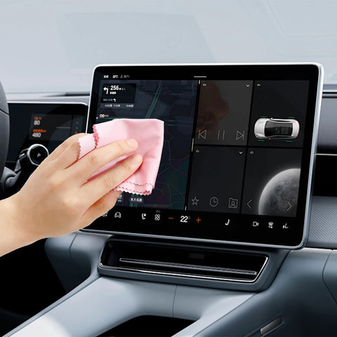 Front view: pink microfiber cleaning cloth wiping car touchscreen display; 6 x 7 inch.