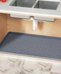 Heavy Duty Silicone Under Sink Mat 14 X 22 Inches with drain holes placed inside kitchen cabinet for moisture protection.