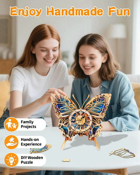 Two women assembling Butterfly Themed 3D Puzzle Clock Kit With Pendulum Wooden Model, showing blue purple wings and Roman numeral dial.