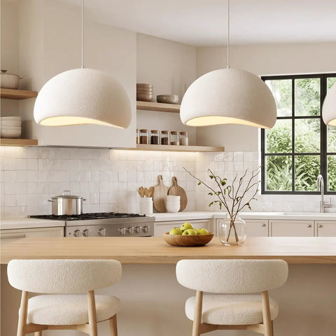 Bennyes Wabi Sabi Pendant Light 19.7 in White hanging above a kitchen island, showcasing cement texture and modern design.