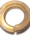 Close-up of a bronze 3/8 inch split lock washer from the Bronze Three Eighths Inch Split Lock Washers Medium Style For Nuts And Bolts Lock Washer Set Of 16 Durable Bronze Hardware Fasteners For Home Auto Farm And DIY Workshop Projects set.