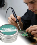 Man using Pro Grade Soldering Iron Tip Cleaner Block For Metal Tips Flux Activator With Abrasive Grains Thermal Shaper on circuit