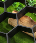 Close-up of hexagonal concrete molds for walkways and pavers with durable black plastic paver molds for outdoor pathways.
