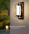 Close-up of a modern black and gold outdoor wall sconce with white diffuser installed on a wall, showcasing brass accents at night.