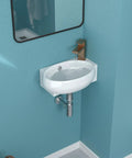 Wall-mounted oval sink with faucet in a modern bathroom with blue walls.