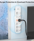Six Outlet Power Strip Surge Protector With Individual Switches And Durable Mountable Design For Under Desk Or Wall Use Protective Case Energy Saving Perfect For Home Office Setup Or Gaming Rig 15A 1875W 6 Ft 14 AWG Cord White mounted on wall