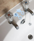 2pcs Silicone Star Bathtub Stopper for Bath Drain, Flat Cover next to faucets in a bathtub setting, showcasing easy use.