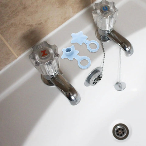 2pcs Silicone Bathtub Drain Stopper Flat Cover Shaped in blue, placed next to faucet in a bathtub setting.
