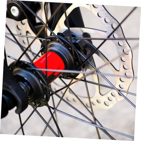 Close-up of No Fuss Mountain Bike Disc Brake Conversion Kit with 160 mm aluminum rotor and black bike hub.