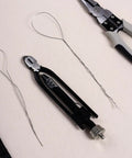 6 Inch Safety Wire Pliers With 25 Feet Stainless Steel Wire Pro Grade Heavy Duty Wire Twisting Tool laying on surface