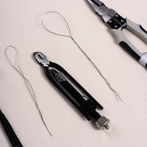 6 Inch Safety Wire Pliers With 25 Feet Stainless Steel Wire Pro Grade Heavy Duty Wire Twisting Tool laying on surface