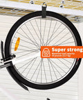 Bicycle wheel suspended by Eight Piece Heavy Duty Cable Organizer Set For Garage And Workshop Storage With Durable Straps Holds Cables Hoses And Ropes Triangle Buckle For Easy Hanging Design Patent Ideal For Organizing Extension Cords And Cables In Garages Sheds Boats And RVs. Features "super strong" 50 lb capacity label.
