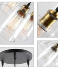 Three Light Black Pendant Light With Seeded Glass Shades showing close-up of glass and gold socket details