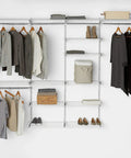 Expandable 26 Inch Shelf Kit Two Shelves White With Durable Epoxy Finish installed in a closet with clothes and storage items