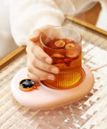 Portable Electric Heating Coaster For Coffee And Tea, 75 Degree Cup Warmer Plate with heated tea in stylish glass.