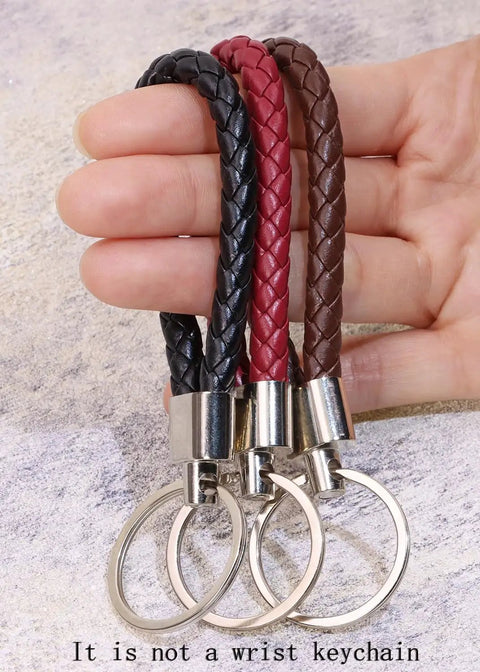 Premium Braided Pu Leather Key Fob With Solid Metal Hardware For Daily Grind Fly Woven Keychain Ring in black, red, and brown.