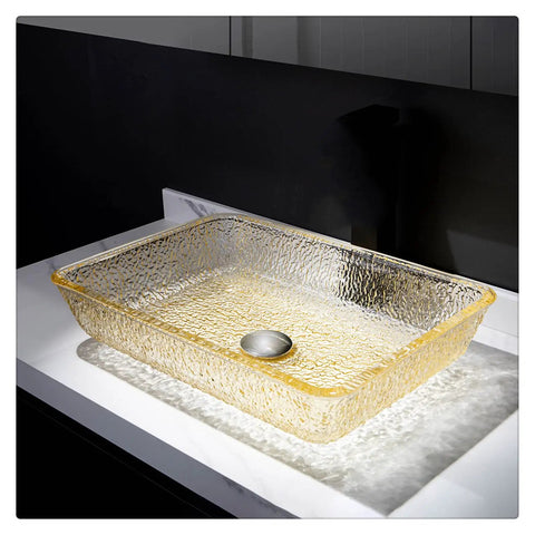 Go Big Or Go Home Bathroom Remodel With This Premium Crystal Glass Vessel Basin Featuring Tough Rectangular Design Heavy Duty Construction Smooth Pop Up Drain And Shatter Proof Build That Seriously Slaps - Yellow tinted rectangular glass basin on countertop with pop-up drain.