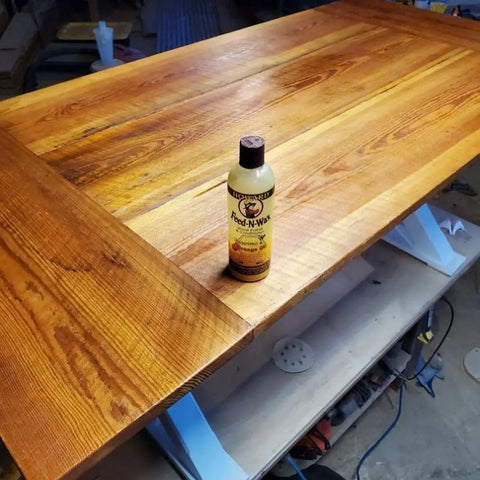 Wood Polish And Conditioner In An 8 Oz Bottle That Nourishes, Protects, And Brings Out Natural Grain And Warm Richness on wooden table