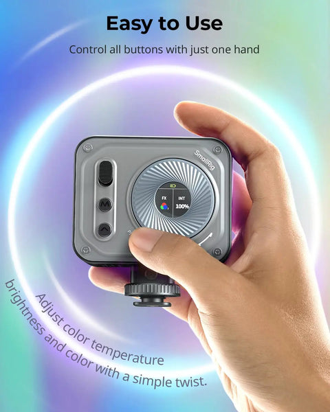 Hand adjusting Vibe P108 Pro RGB Video Light For Cameras using LCD screen, small portable LED with cold shoe mount.