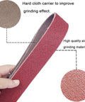 Hand holding 18 Pack 1-1/2 X 30 Inch Sanding Belts Set For Pipe Tubing Polisher Sander With 60 80 120 150 240 400 Grit Aluminum Oxide Belts