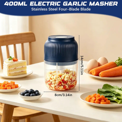 Portable Cordless Electric Garlic Chopper And Vegetable Dicer With 400ml Capacity For Onions Ginger Peppers on kitchen table.