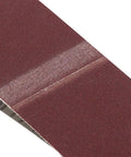 Close-up view of Kickass Aluminum Oxide Sanding Belts 10 Pack 320 Grit Heavy Duty Abrasive Bands for woodworking.