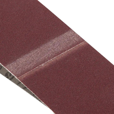Close-up view of Kickass Aluminum Oxide Sanding Belts 10 Pack 320 Grit Heavy Duty Abrasive Bands for woodworking.