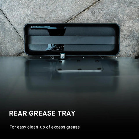 Rear grease tray of Digital Electric Vertical BBQ Smoker With Patented Side Wood Chip Loader And Chrome Racks 710 Square Inches