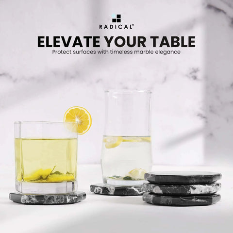 Slick Black Star Marble Coasters Set Of Six Natural Polished Stone Drink Guards For Coffee And Dining Tables Modern Minimalist Surface Protection shown with drinks.