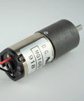 16mm 12V Geared DC Motor With 1/256 Gear Ratio, shown close-up with metal casing, wires, and compact design.