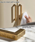 10 Pack Antique Brass Cabinet Pulls Square Design With Five Inch Center to Center About Five and Two Fifths Inches Long Solid Zinc Alloy Kitchen Cabinet Handles Polished Gold Drawer Pulls Hardware being cleaned with a cloth.