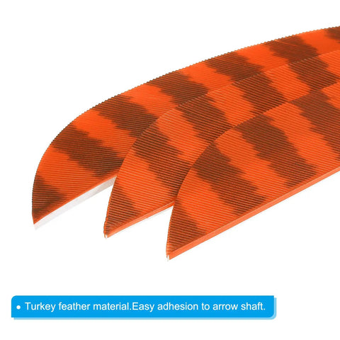 Close-up of Shield Cut Arrow Vanes 10 Pack Four Inch Turkey Feather Fletching Orange Right Wing arrows.
