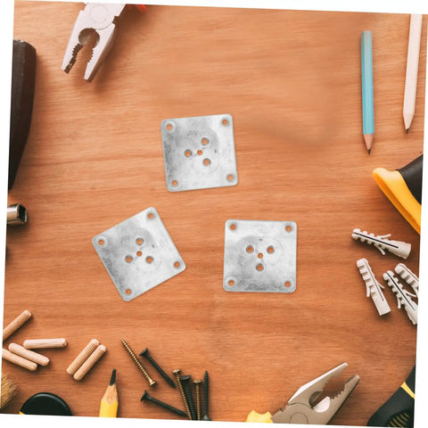 Rock Solid 25 Pack Furniture Leg Mounting Plates and Heavy-Duty Iron Brackets on wooden surface with tools and hardware.