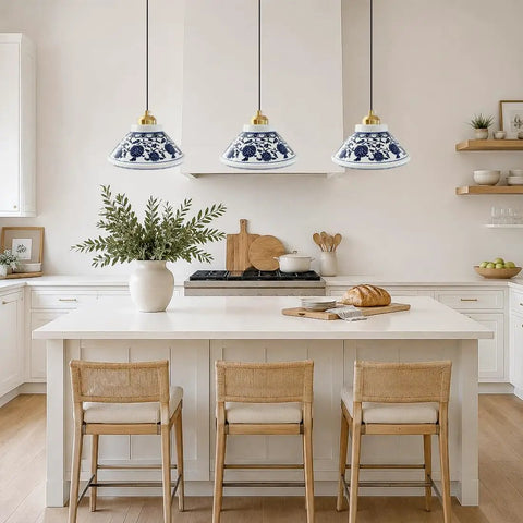 SIMEESO Ceramic Pendant Light in a kitchen setting with blue and white porcelain and gold accents over an island.