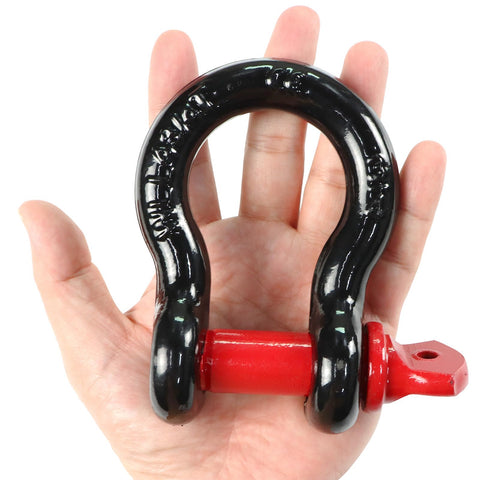 Hand holding a 2 Pack 0.75 Inch D Ring Shackles Beefy Heavy Duty Forged Steel Screw Pin Shackles WLL 4.75T Built For Tractors Trucks Winches
