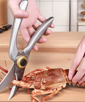 Heavy Duty Kitchen Scissors With Non Slip Handle And Auto Unlock For Cutting Meat Poultry Roasts Turkey And Fish Serrated Stainless Steel Blades With Ergonomic Grip Tough Yet Easy To Use Everyday Kitchen Tool shown cutting lobster