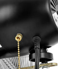 Close-up of Beefy Deluxe Wall Mount Fan 30 Inch Diameter With Fixed And Oscillating Head power cord and pull chain, industrial grade.