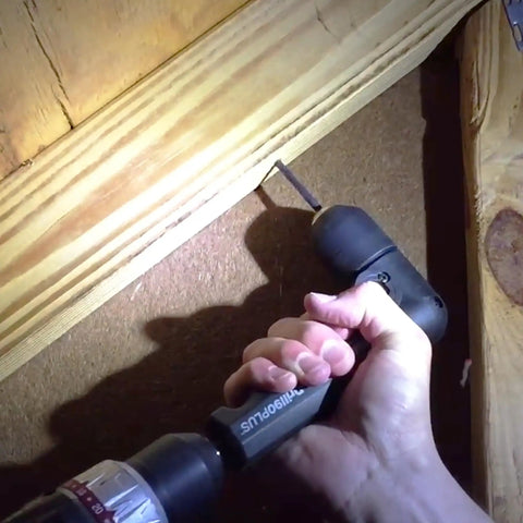 Person using Right Angle Drill Attachment With 3 Eighth Inch Chuck And 6 Sided Hex Shank in tight wooden space