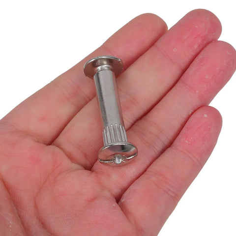 Rock Solid 100 Piece Pack M6 Cabinet Panel Binding Bolt in hand made from cold rolled steel for furniture assembly.